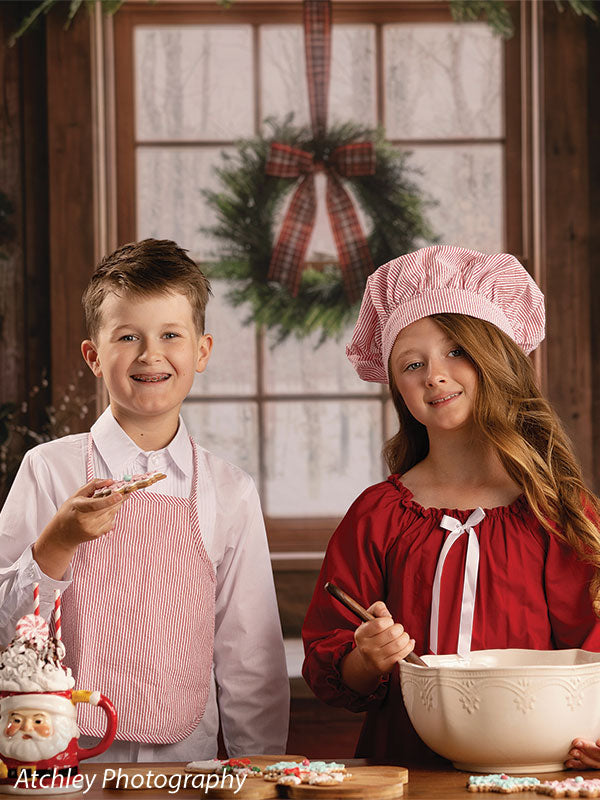red cabin rustic christmas kitchen photography backdrop boy and girl smiling closeup CP 8887