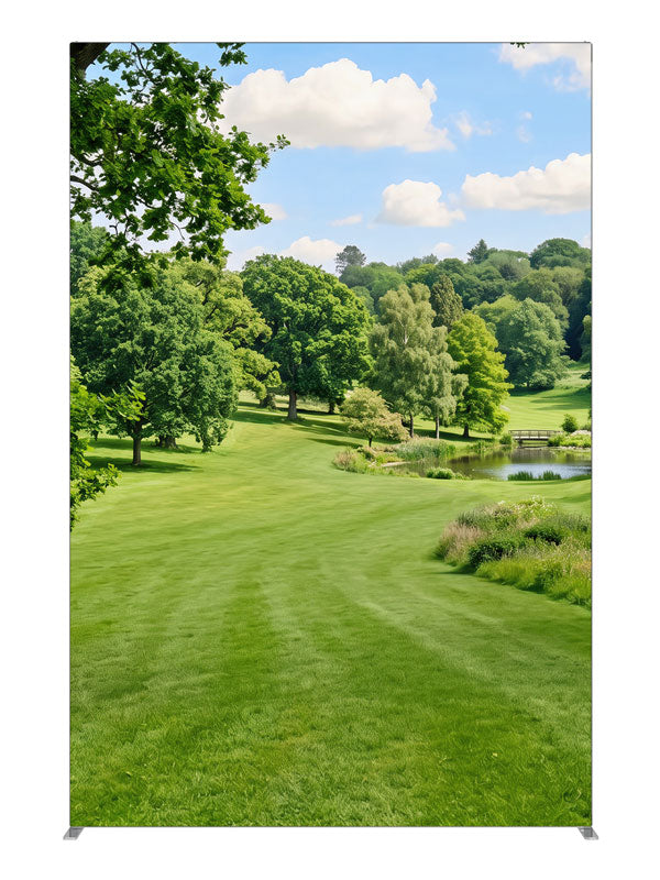 Naturalistic rolling parkland with a small pond, footbridge and wooded hills, 5ft photography backdrop panel for Denny StudioEdge silicone edge frame