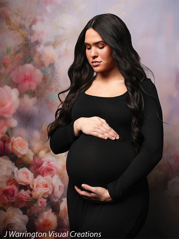 Soft-focus floral photography backdrop with peonies and roses for portrait sessions.