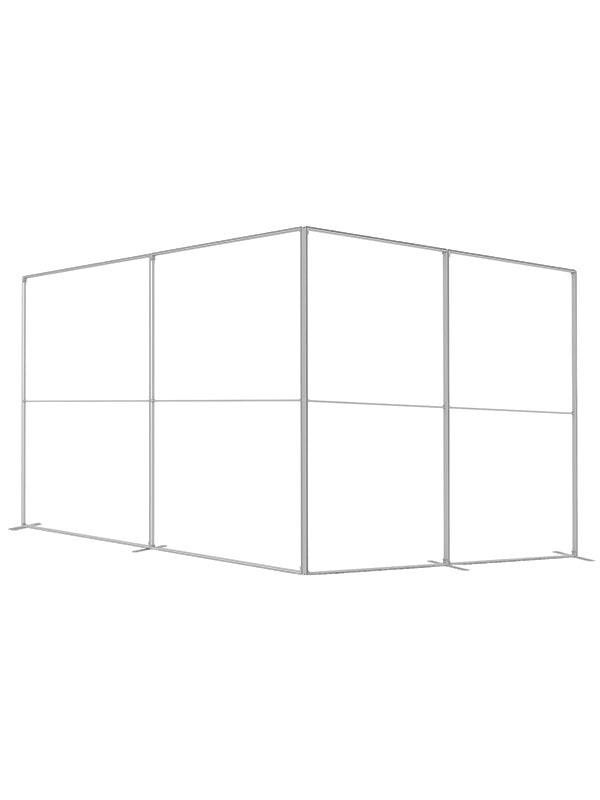 Multiple frame panels joined into an L-shaped room configuration, viewed from an alternate wide angle, in lightweight silver aluminum — part of the Denny StudioEdge modular backdrop frame system.
