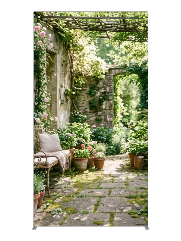 An English garden courtyard with a vine-draped pergola, climbing roses and a flagstone path to an arched doorway, 4ft photography backdrop panel for Denny StudioEdge silicone edge frame