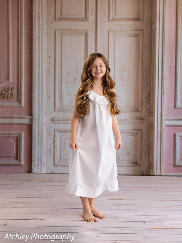 Rose Parlor distressed pink French double doors photography backdrop shown with a young girl in a white slip dress laughing, full-length CP-8793