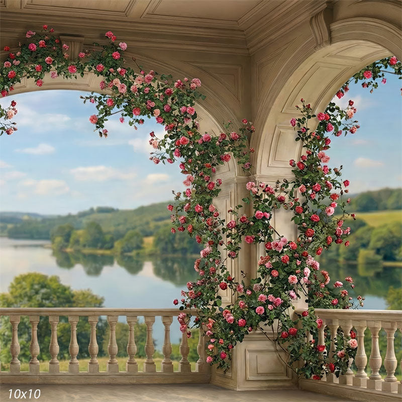 This photography backdrop features a classical stone terrace with flowering rose vines framing arched openings and a scenic landscape. The studio background creates depth and romantic detail behind a portrait subject.
