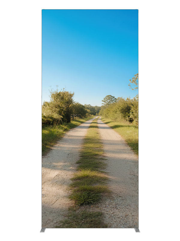 A sunny rural dirt lane between green fields with a split-rail fence under a blue sky, 3ft photography backdrop panel for Denny StudioEdge silicone edge frame