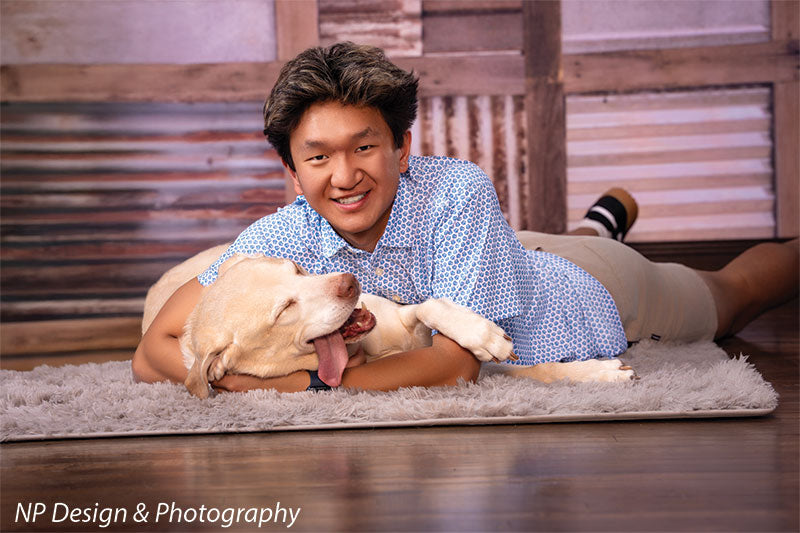 Rustic metal squares photography backdrop shown with a senior boy lying on the floor with his yellow Labrador, wide view CP-7630