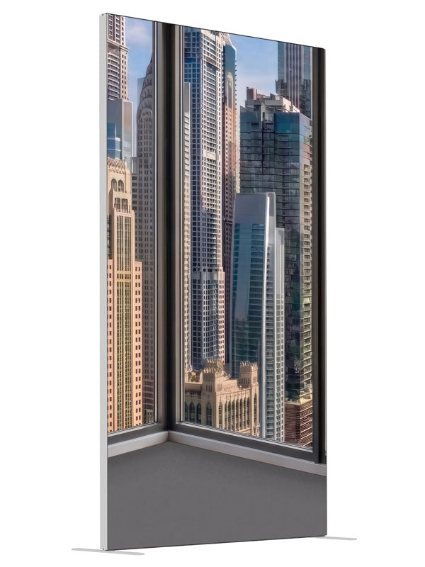 An empty modern room corner with windows over a sunlit daytime skyscraper skyline, 4ft photography backdrop panel for Denny StudioEdge silicone edge frame, angled view