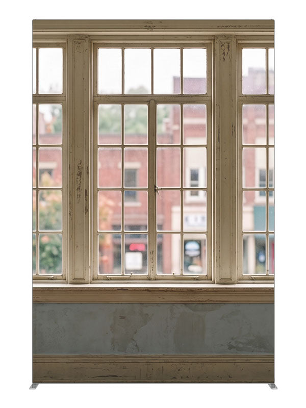 Weathered cream multi-pane windows overlooking a small-town brick main street, 5ft photography backdrop panel for Denny StudioEdge silicone edge frame