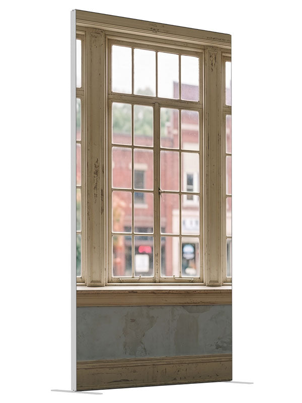Weathered cream multi-pane windows overlooking a small-town brick main street, 4ft photography backdrop panel for Denny StudioEdge silicone edge frame