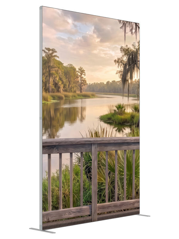 Weathered railing over a southern bayou with moss-draped cypress at peach sunset, 5ft photography backdrop panel for Denny StudioEdge silicone edge frame, angled view