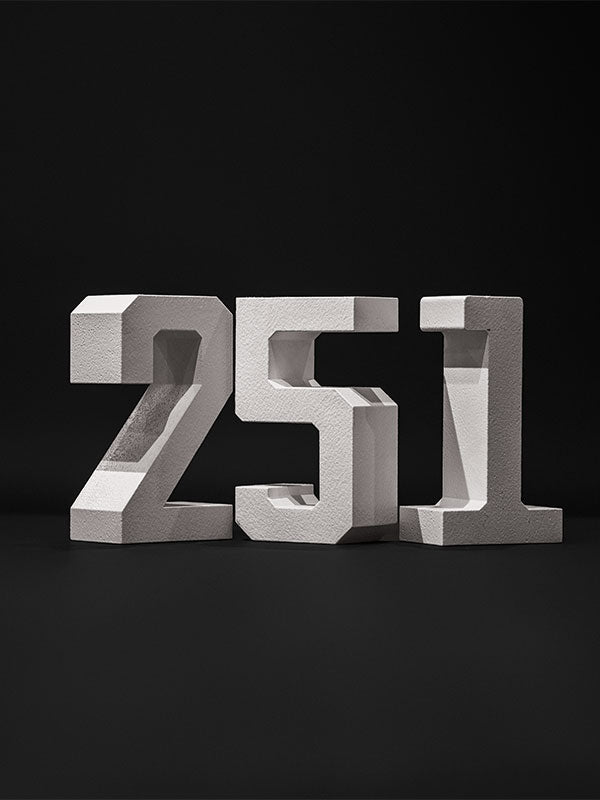 White hard-coated foam stand-alone number props arranged as 251 on a dark studio background.