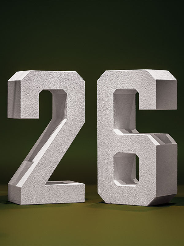 White hard-coated foam stand-alone number props showing 26 on a green background.
