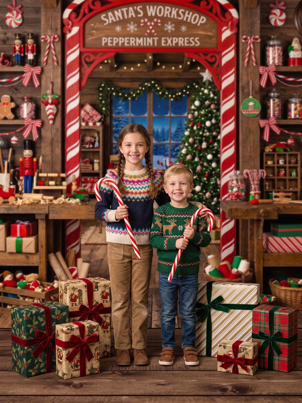 Sugar Workshop Santa's workshop interior with candy cane arch and peppermint sign photography backdrop shown with two children holding candy canes CP-8910