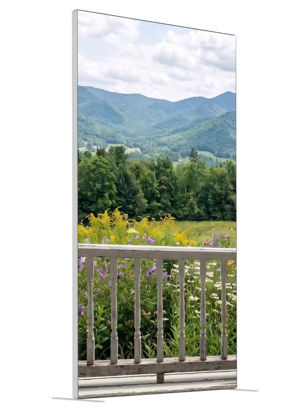 White porch railing above a summer mountain meadow of purple and yellow wildflowers, 4ft photography backdrop panel for Denny StudioEdge silicone edge frame, angled view