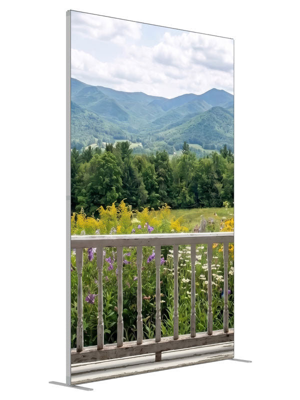White porch railing above a summer mountain meadow of purple and yellow wildflowers, 5ft photography backdrop panel for Denny StudioEdge silicone edge frame, angled view
