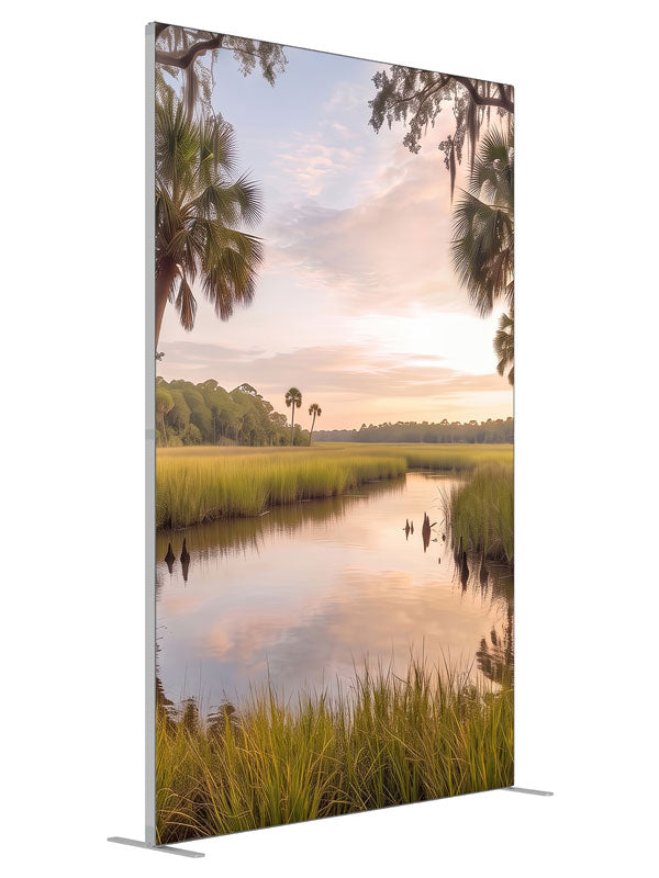 Still bayou creek winding through golden marsh grass at sunset with palmettos and moss-draped oak branches, 5ft photography backdrop panel for Denny StudioEdge silicone edge frame, angled view