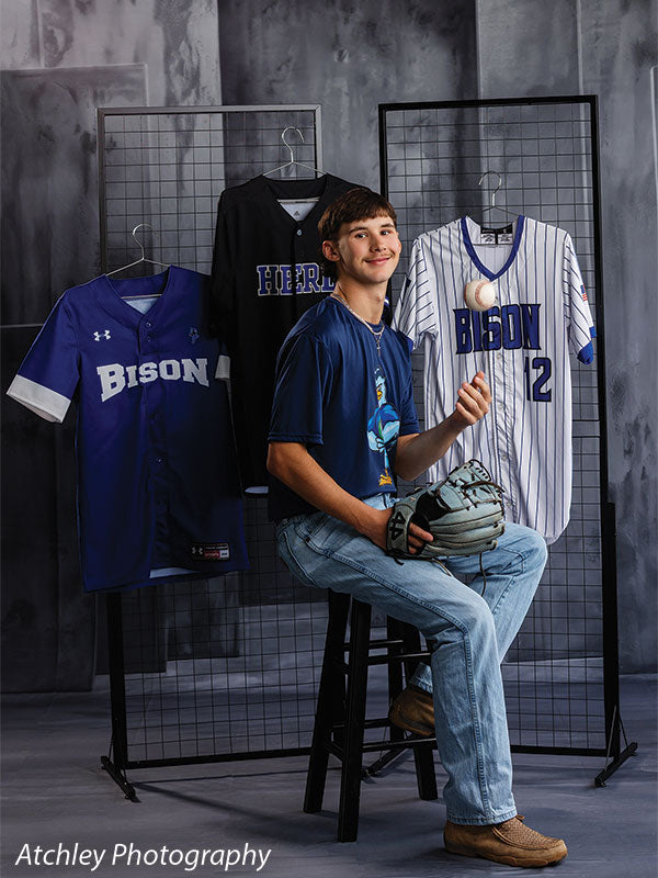 Textured Gray multi-panel photography backdrop shown with a senior athlete seated with a glove and ball beside a jersey rack CP-8817