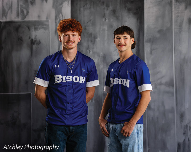 Textured Gray multi-panel photography backdrop shown with two senior athletes in blue Bison baseball jerseys, wide view CP-8817