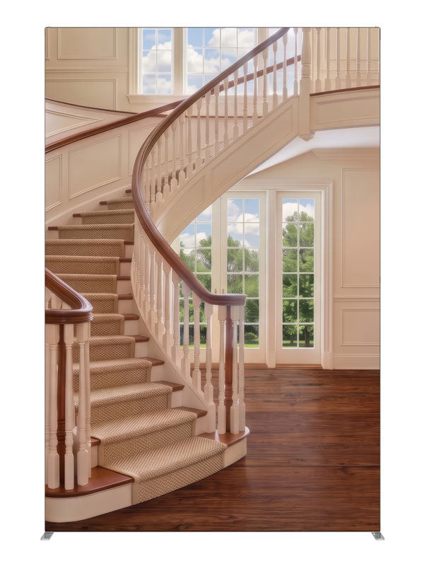 A cream curved staircase in a bright two-story foyer with tall windows and open hardwood floor, 5ft photography backdrop panel for Denny StudioEdge silicone edge frame
