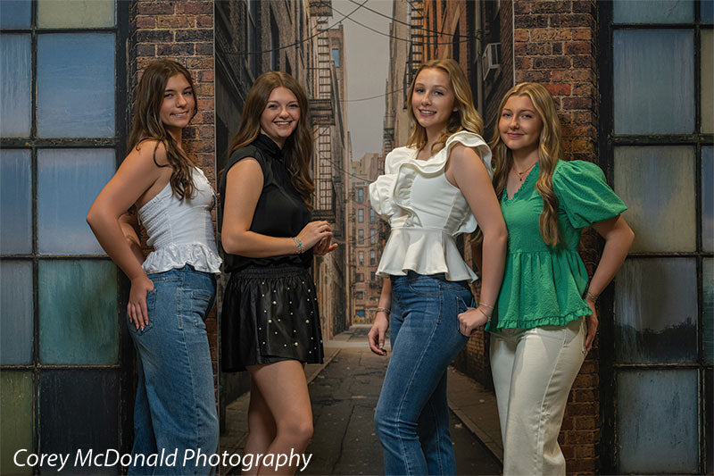 Trevino Graffiti Alley, photography backdrop panel for Denny StudioEdge silicone edge frame, shown with four senior girls posed along the painted alley wall SECP-8862