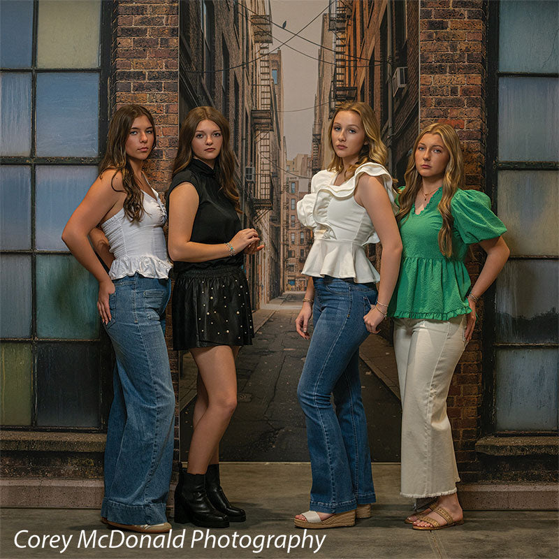 Trevino Graffiti Alley, photography backdrop panel for Denny StudioEdge silicone edge frame, shown with four senior girls posed together against the painted brick alley SECP-8862