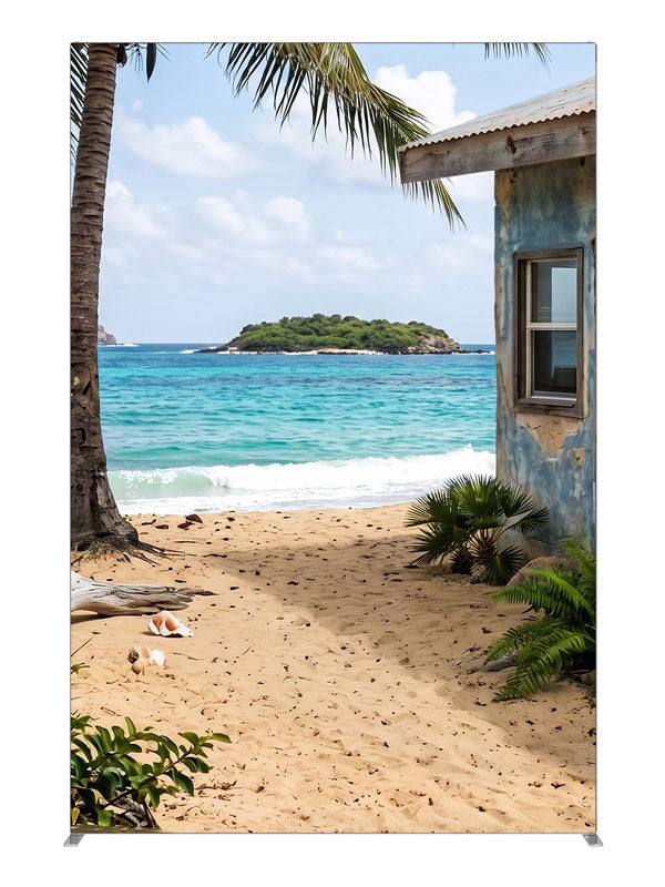A weathered beach shack beside white sand, a leaning palm and a turquoise bay with an offshore islet, 5ft photography backdrop panel for Denny StudioEdge silicone edge frame