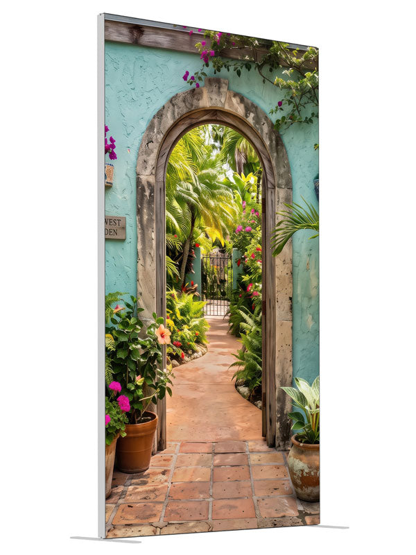 A turquoise stucco courtyard wall with a stone archway opening onto a lush tropical garden, 4ft photography backdrop panel for Denny StudioEdge silicone edge frame, angled view