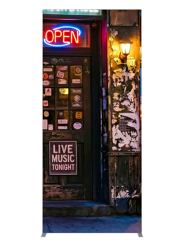 Gritty neon-lit city bar corner at night with live-music signage and a sticker-covered door, 3ft photography backdrop panel for Denny StudioEdge silicone edge frame