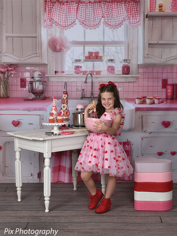 Festive Valentine's Day kitchen backdrop with heart decor and pink gingham accents for portrait photography and themed sessions.