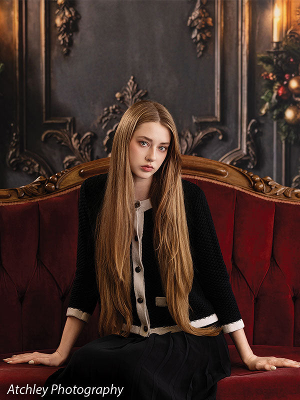 Velvet Swag ornate gray paneled wall with red velvet draping photography backdrop shown with a senior girl leaning back on the red velvet sofa CP-8899
