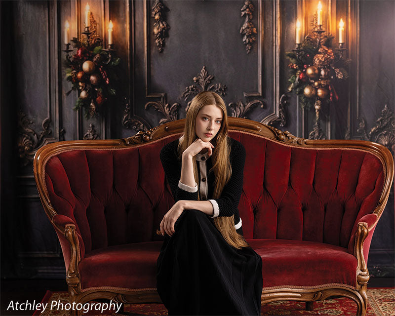 Velvet Swag ornate gray paneled wall with red velvet draping photography backdrop shown with a senior girl seated on the sofa with hand on chin, wide view CP-8899