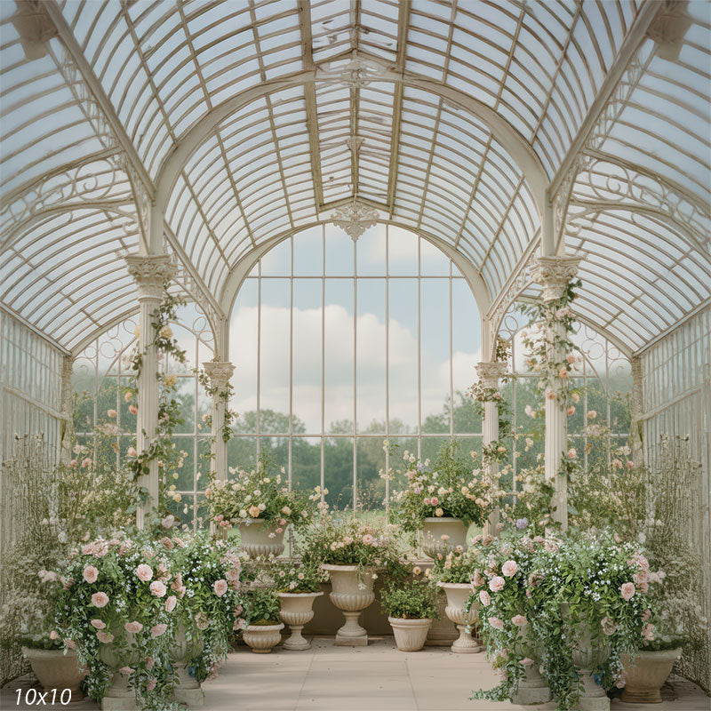 Elegant glass solarium filled with pastel roses and greenery in stone urns, framed by ornate columns and soft natural light.