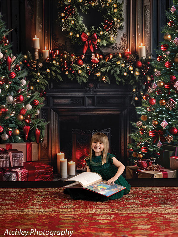 Vintage Christmas fireplace backdrop with decorated garland and holiday trees, shown with a young girl in a green dress smiling and holding an open book, ideal for storytelling holiday portraits.