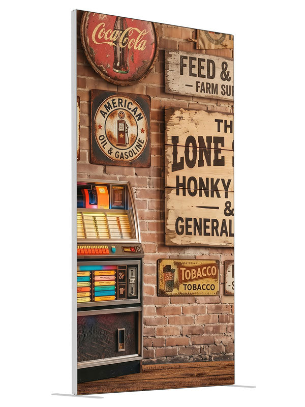 A lit retro jukebox against a red-brick wall of vintage-style roadhouse signage over a plank floor, 4ft photography backdrop panel for Denny StudioEdge silicone edge frame, angled view