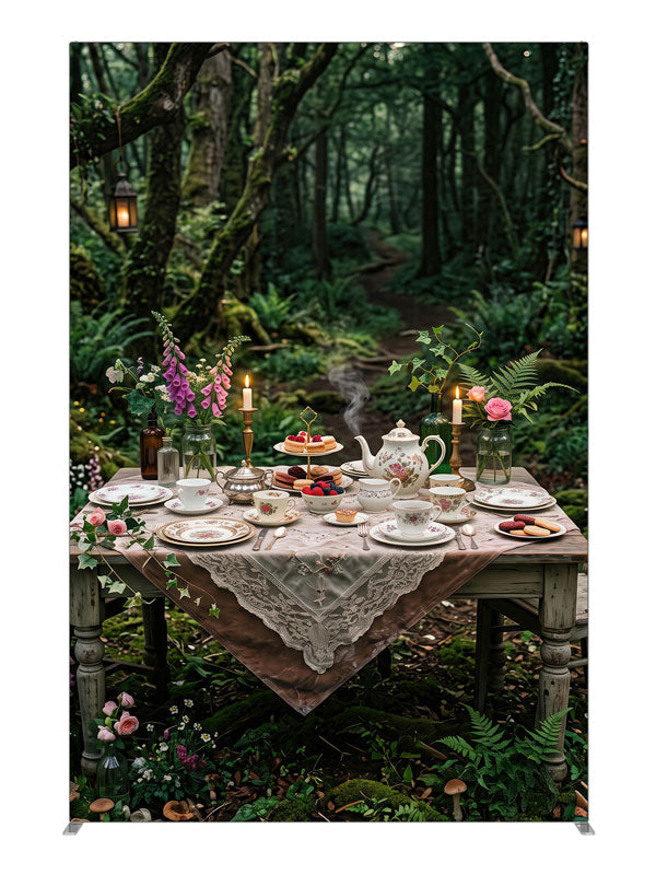 A storybook tea-party table with florals and candlelight set in a mossy enchanted forest with lanterns, 5ft photography backdrop panel for Denny StudioEdge silicone edge frame