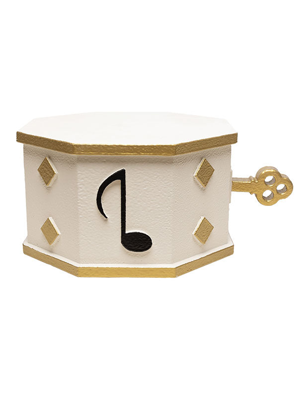 White and gold wind-up music box prop featuring musical note and diamond embellishments, designed for classical or vintage-themed studio backdrops.