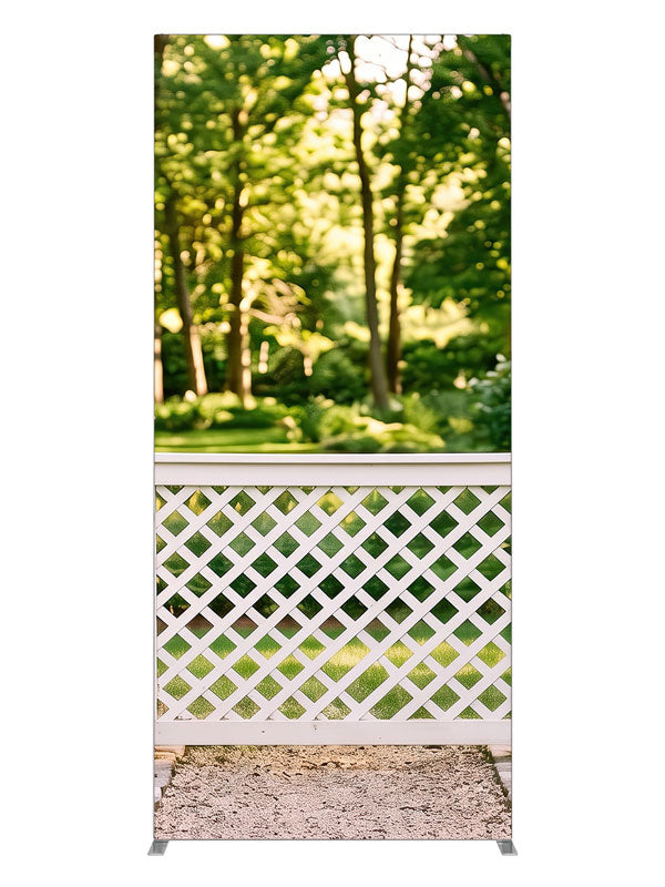 White lattice garden fence with square-capped posts against a sunlit green tree canopy, 3ft photography backdrop panel for Denny StudioEdge silicone edge frame