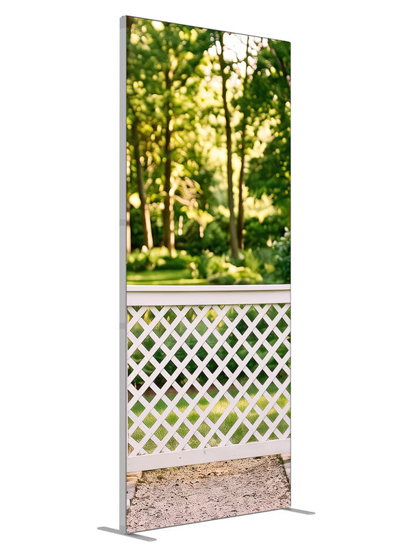 White lattice garden fence with square-capped posts against a sunlit green tree canopy, 3ft photography backdrop panel for Denny StudioEdge silicone edge frame, angled view