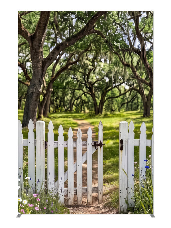 Open white picket gate in a low fence with a dirt path leading into a moss-draped live oak grove, 5ft photography backdrop panel for Denny StudioEdge silicone edge frame