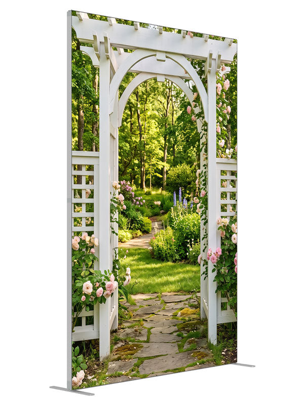 White garden arbor with climbing pink roses over a flagstone path into a shaded green garden, 5ft photography backdrop panel for Denny StudioEdge silicone edge frame, angled view