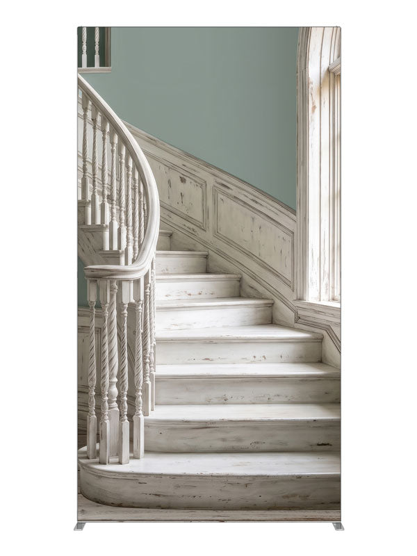 A distressed whitewashed curved staircase with sage walls and an arched window onto sunlit palms, 4ft photography backdrop panel for Denny StudioEdge silicone edge frame
