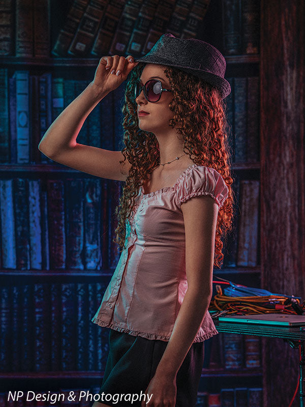 Worn volumes book shelf photography backdrop shown with a senior girl wearing a fedora hat and sunglasses CP-7317