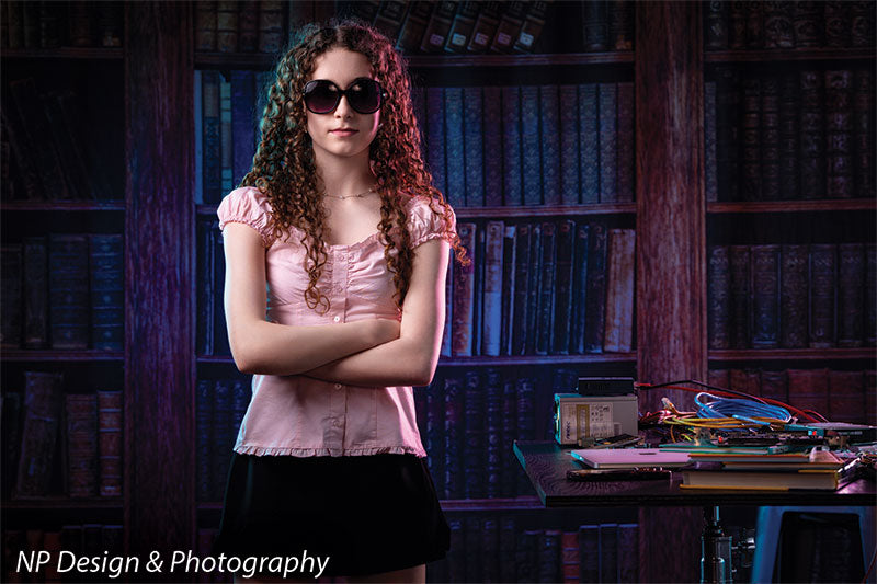 Worn volumes book shelf photography backdrop shown with a senior girl in sunglasses standing with her arms crossed CP-7317