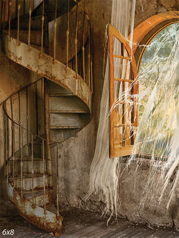 Abandoned Spiral Staircase Photography Backdrop - A photography backdrop featuring an abandoned spiral staircase with a rusted finish, a rustic open window, and tattered curtains.