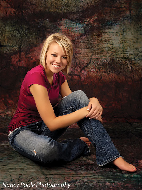 Rich textured backdrop with cracked surface and deep earth tones for moody portraits.