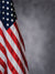 American Flag Photography Backdrop - American flag photography backdrop with a soft gray background, perfect for patriotic portraits and special events.