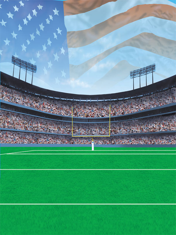 Green football field with centered goalposts, stadium crowd, and American flag in the sky.
