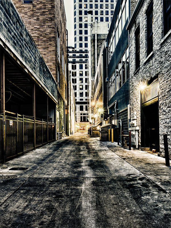 Austin Urban City Alley Backdrop - Gritty urban alley in Austin with tall buildings, dramatic lighting, and a distant cityscape of high-rise structures.