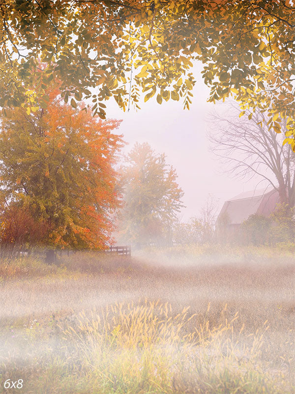 Autumn Misty Field Photography Backdrop - Photography backdrop featuring a serene mist-covered field with trees in autumn hues of yellow, orange, and green, ideal for creating a peaceful setting.