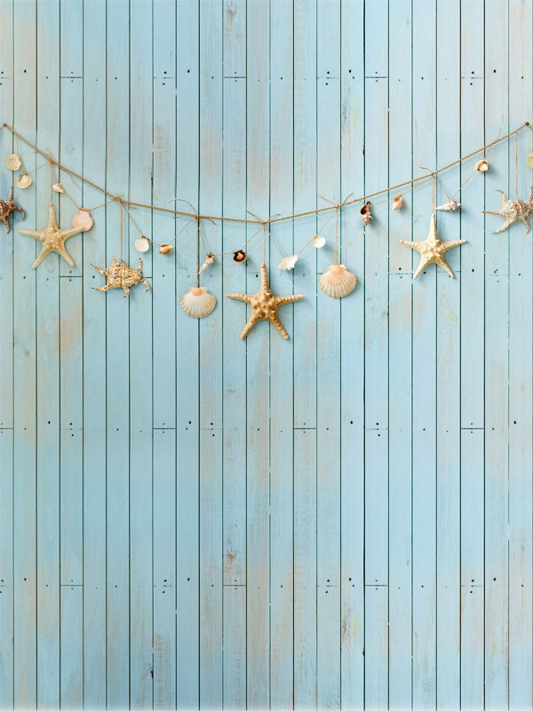 Beach-Themed Seashell & Starfish Photography Backdrop - Beach-themed seashell and starfish photography backdrop with light blue wood planks and garland for kid-friendly summer photoshoots.