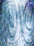 Swirled blue backdrop with etched circular patterns and distressed textures.
